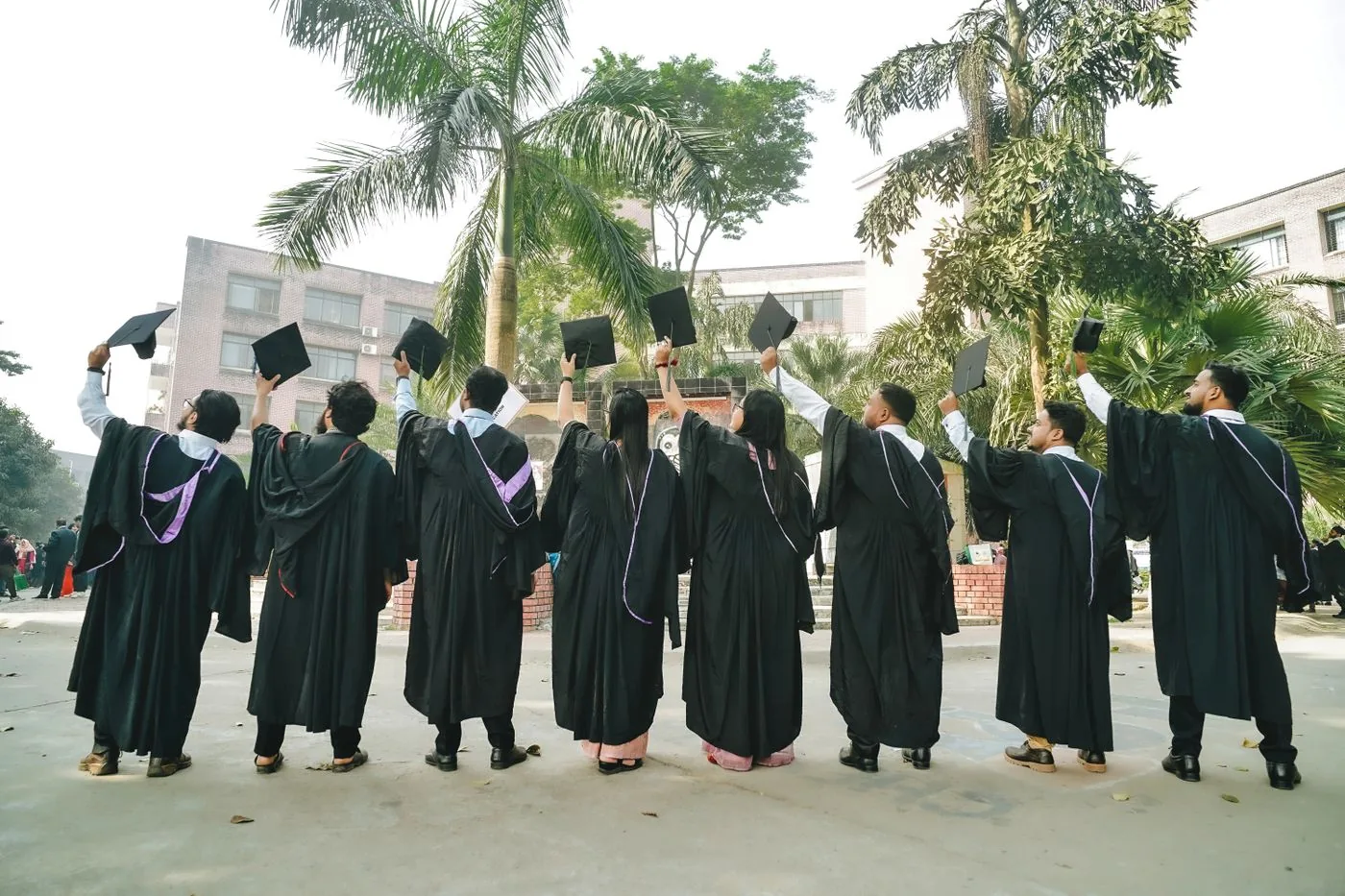 Graduates throwing their caps in celebration