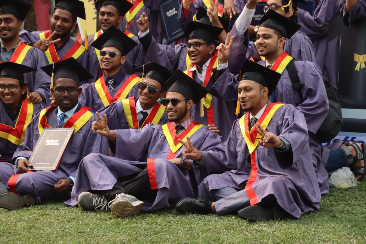 Graduates celebrating with their certificates