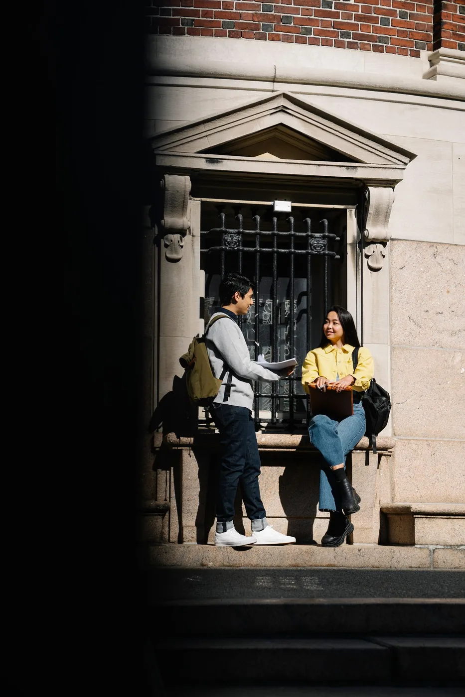 Students chatting together outside on campus