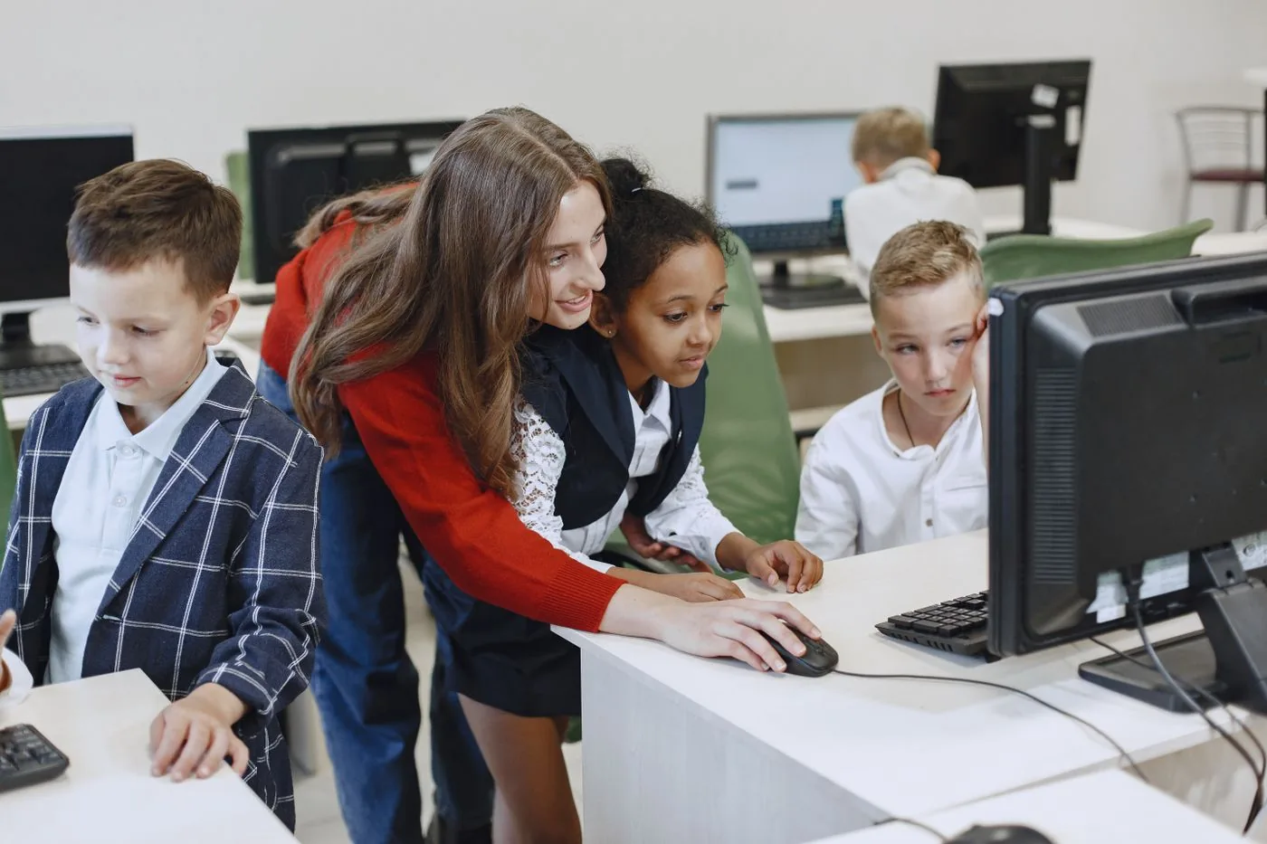 An instructor guiding students through a technology workshop
